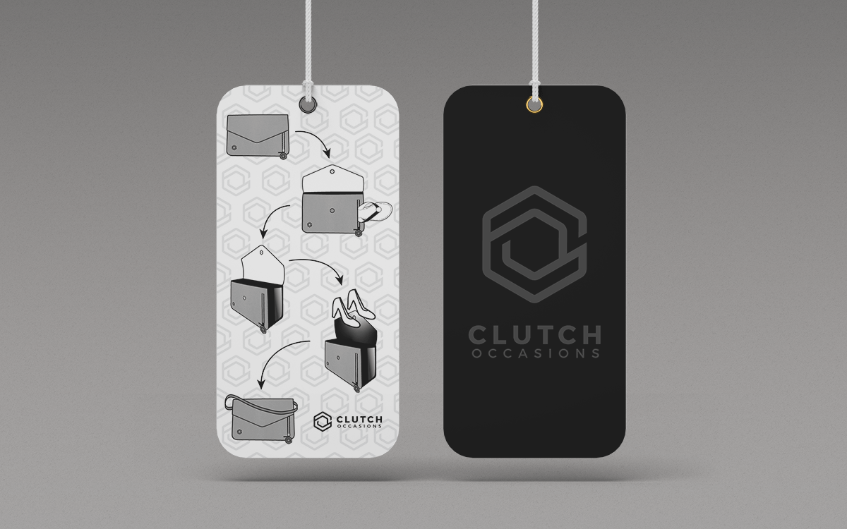 A black and white tag with the word clutch on it is hanging from a string.