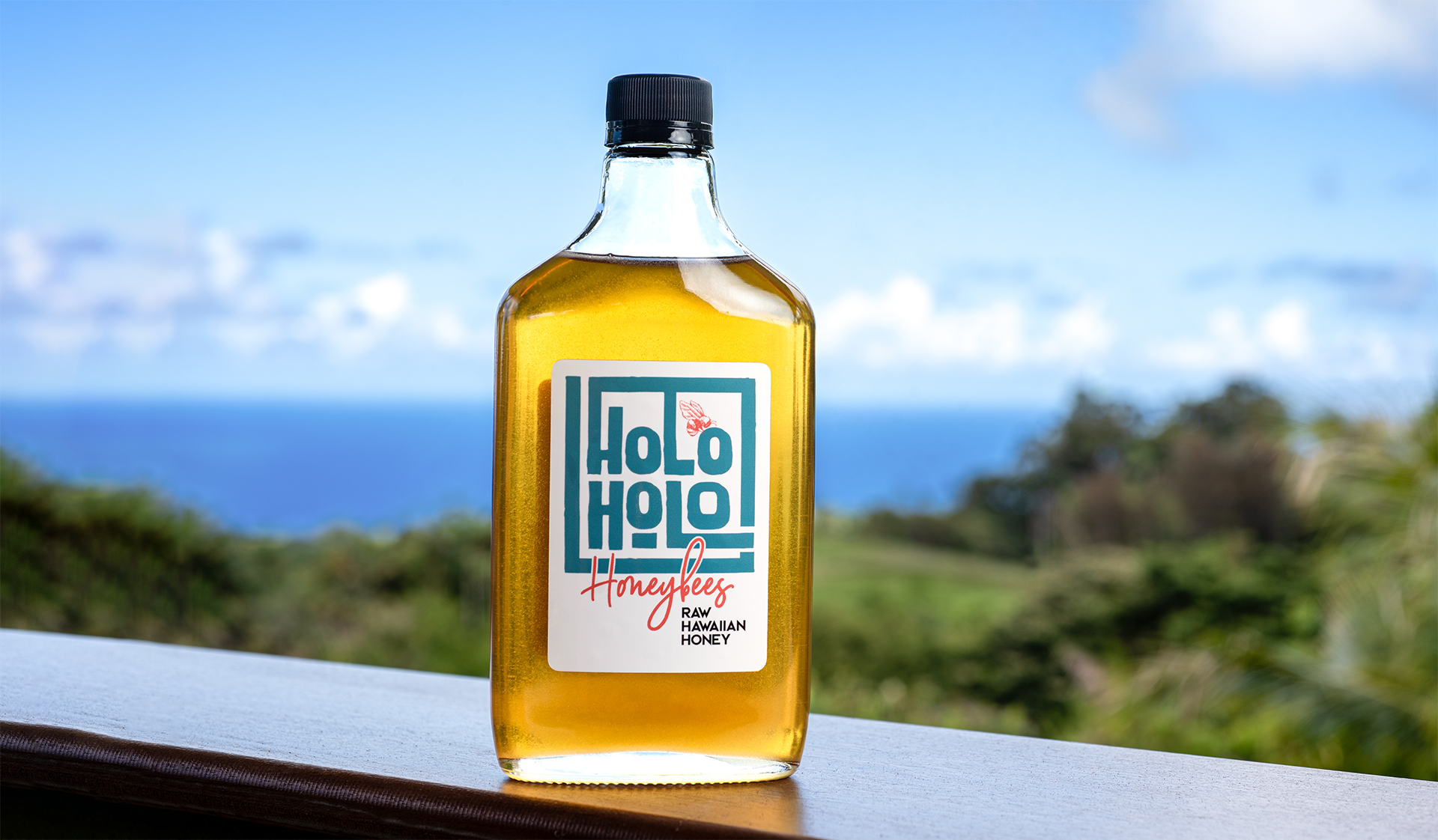 A bottle of holo holo is sitting on a table