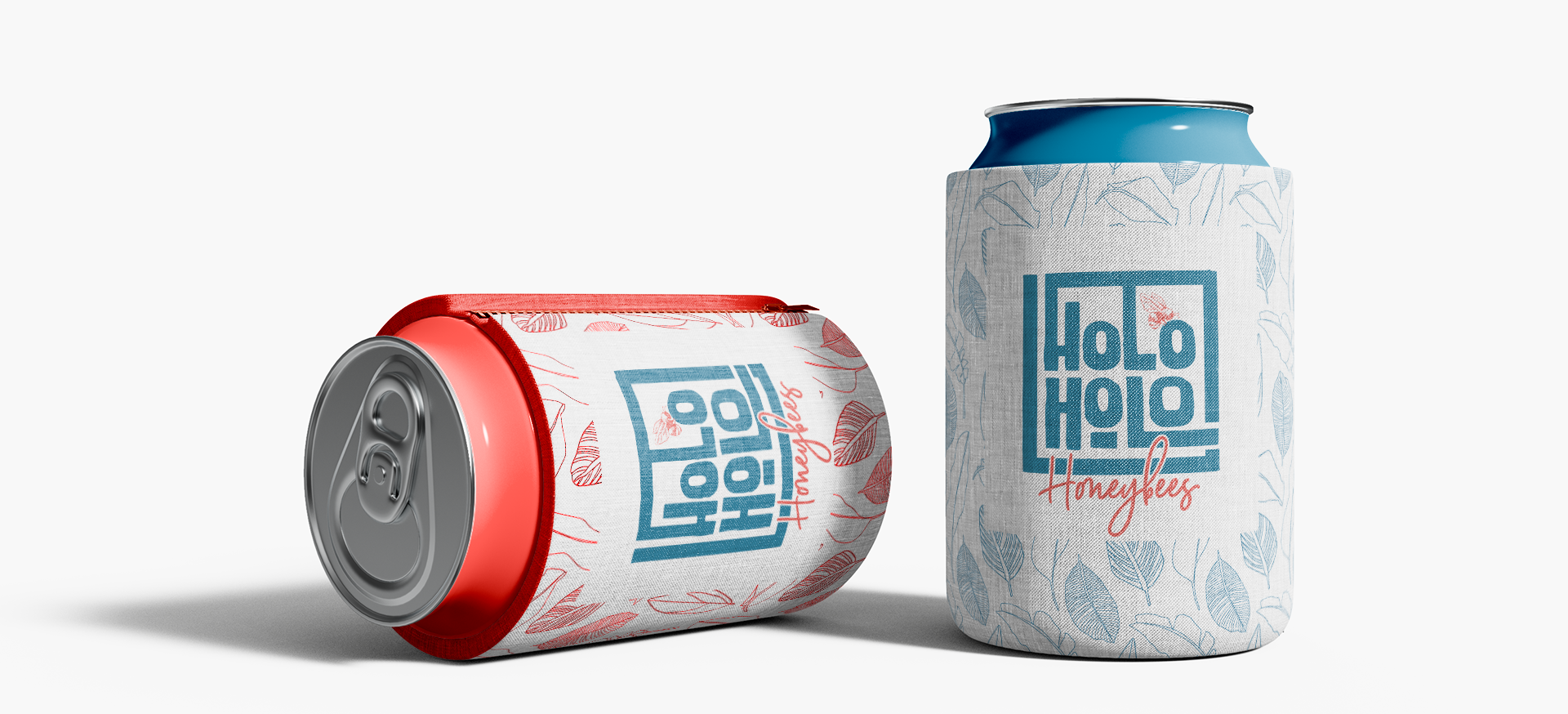 Two cans of soda are sitting next to each other on a white surface.