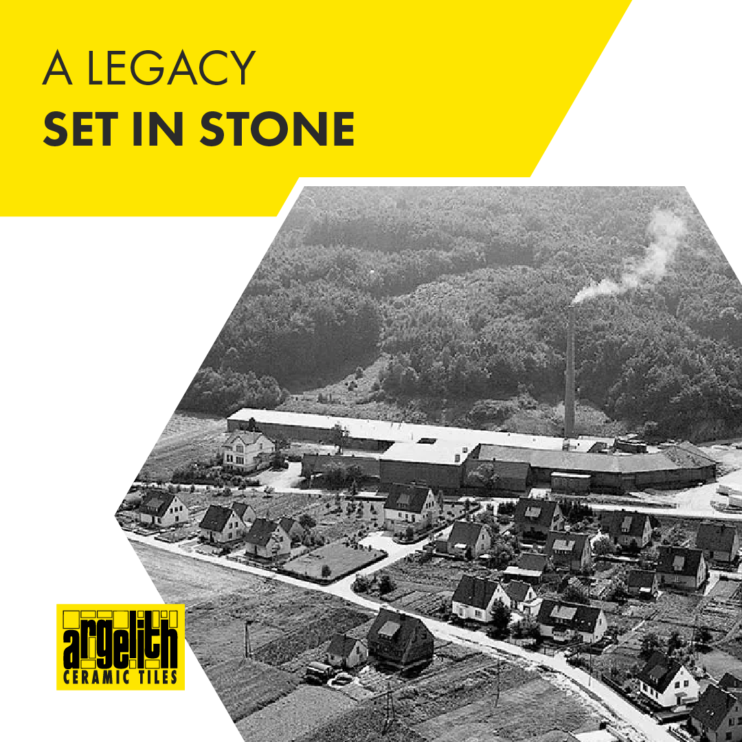 Aerial black-and-white view of a factory near houses with Argelith Ceramic Tiles logo and 