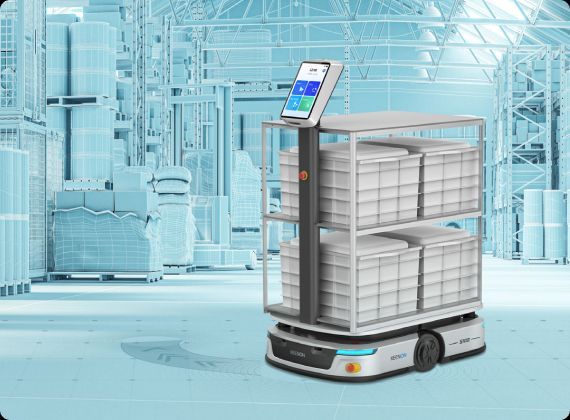 Robot carrying cargo in a warehouse. It has shelves filled with bins, a touchscreen, and is navigating the space.