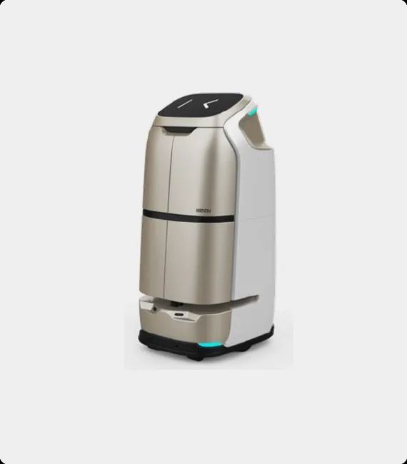 Robot cleaner, gray and black, with a screen displaying a smiling face. Has cleaning brushes, on a white background.