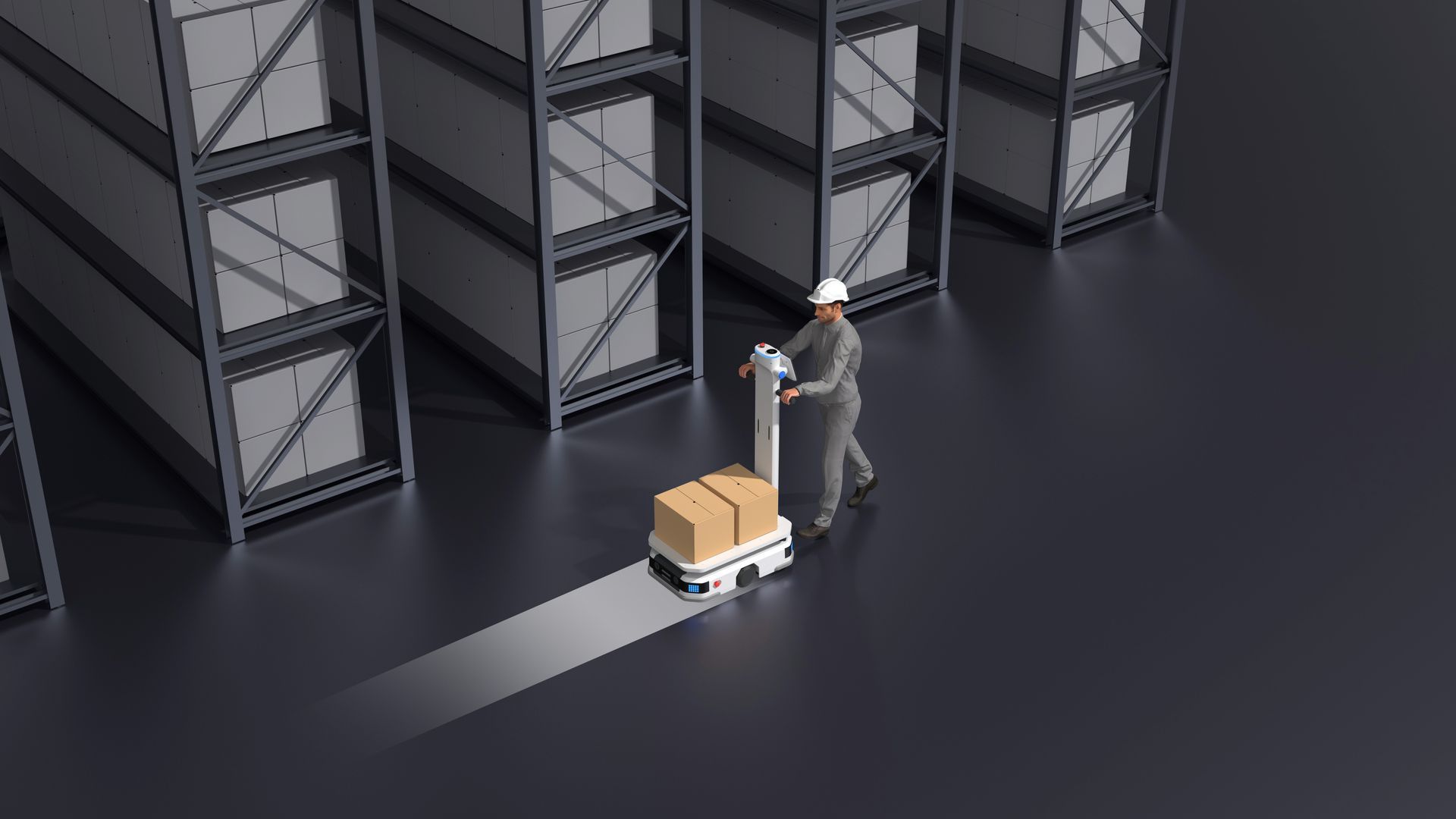 Worker moving a cardboard box on a pallet jack in a warehouse aisle among stacked crates