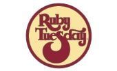 Ruby Tuesday logo in burgundy on a cream circle with a stylized yellow “T”