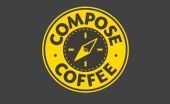 Yellow circular Compose Coffee logo with a black coffee cup and bold black text