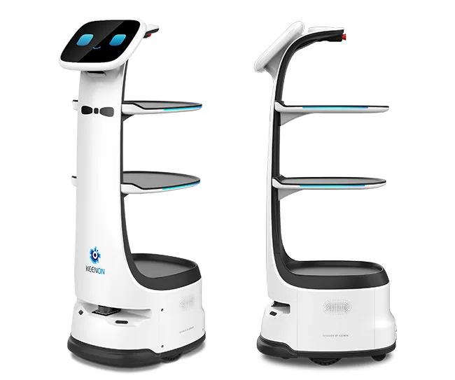 White service robot with shelves, blue eyes on screen, standing on a gray platform in front of a gray background.