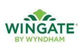 Wingate by Wyndham logo in green and gold text with a leaf icon above the wordmark
