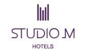 Studio M Hotels logo in purple text with vertical line icon above it on a white background