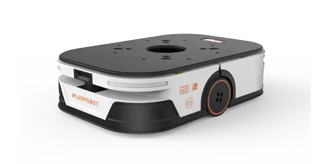 Compact white-and-black robot vacuum with orange accents on a white background