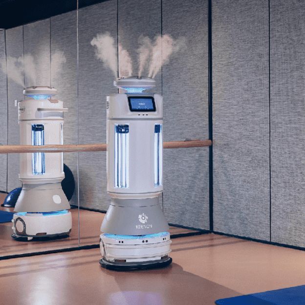 Robot carrying packages in an elevator. The robot is silver and blue with boxes on its shelves. Bright interior.