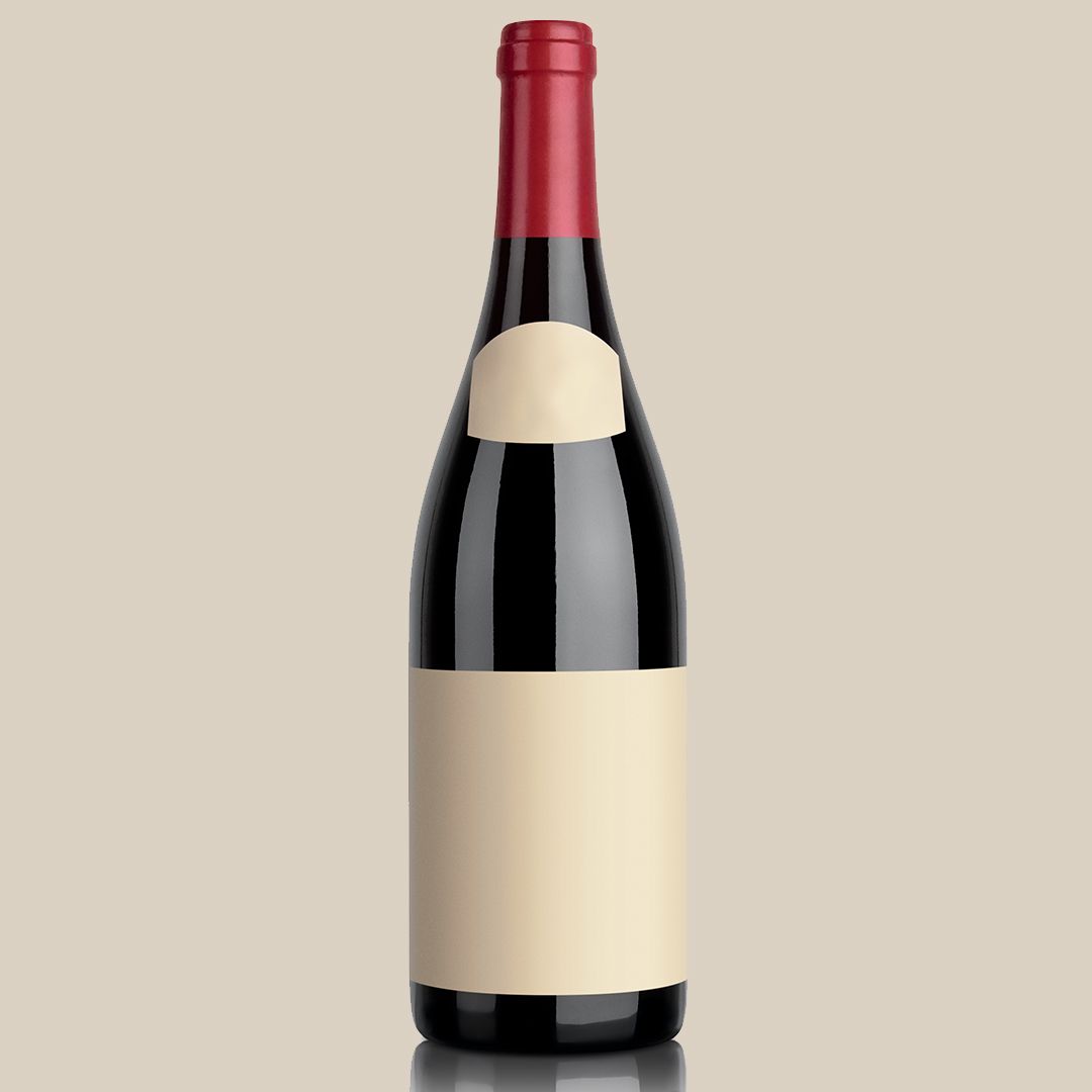 A bottle of wine with a white label and a red cap