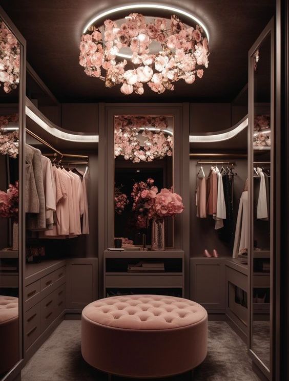 Elegant closet or dressing room with floral chandelier and dark wood cabinetry
