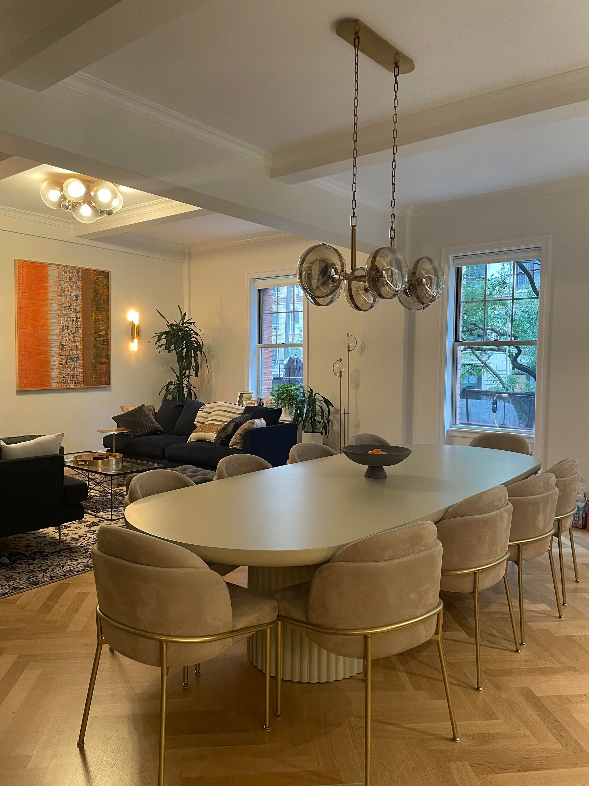 Dining area with decorative chandelier, ceiling beams, wall art, and window view, Dining table and chairs