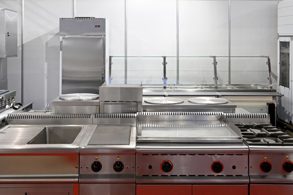 A Kitchen With Stainless Steel Appliances And A Sink — Appliance City in Lake Cathie, NSW