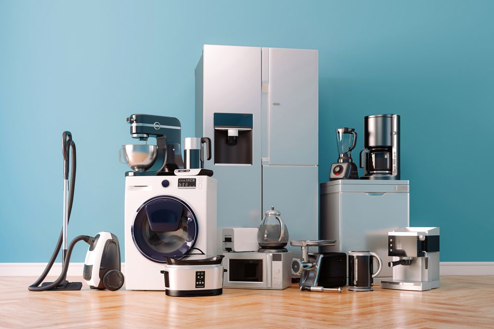 A Bunch Of Home Appliances Are Kept On A Wooden Floor — Appliance City in Lake Cathie, NSW