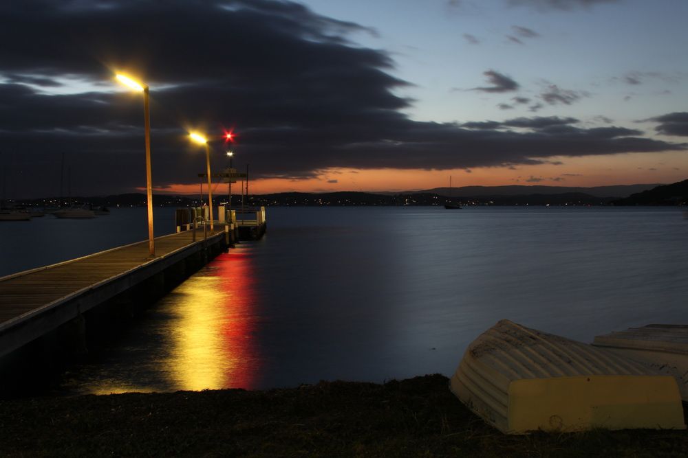 Scenic Evening View of Shore with Lights at Port Macquarie Lake — Appliance City in Port Macquarie, NSW