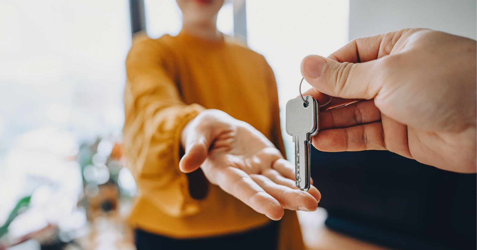 Hand receiving keys for rental home Hand receiving keys for rental home