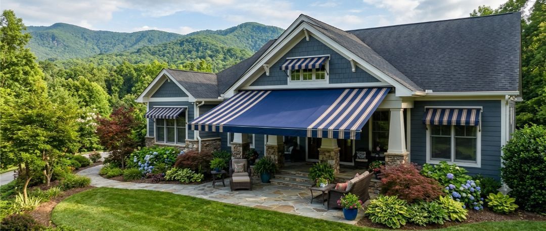 Striped retractable deck awning on a craftsman home in Arden, NC