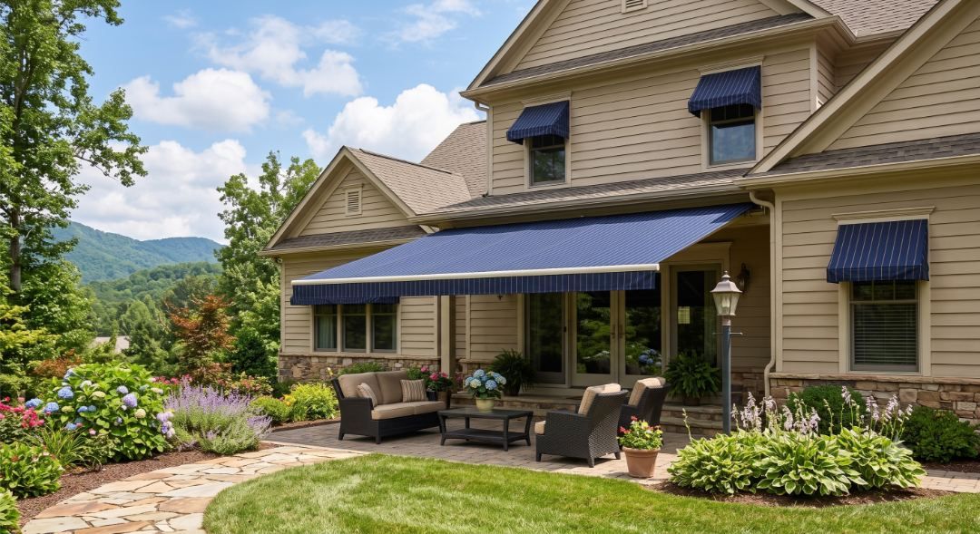 Retractable awning extended over a stone patio seating area, illustrating an Exterior Awnings Asheville install in Biltmore Park, Arden, NC