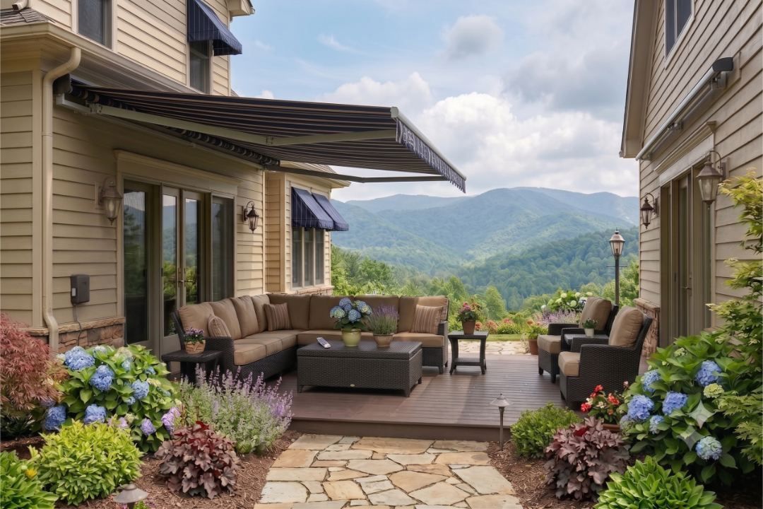 Motorized retractable awning extended over a west-facing deck with a Blue Ridge view, the setup Exterior Awnings Asheville installs in Hendersonville, NC