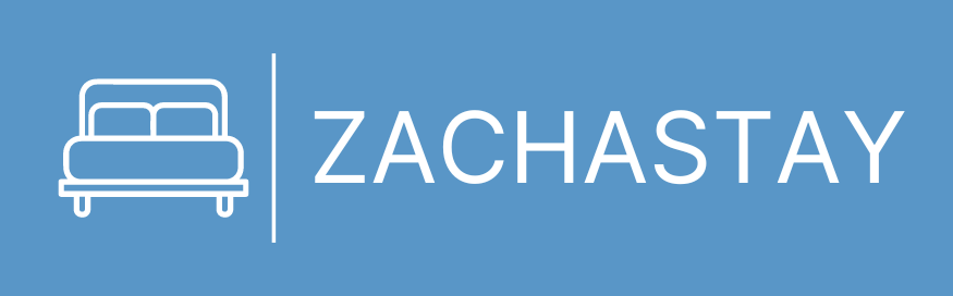 Blue logo with a white outlined sofa icon above the word “ZACHTASTAY”