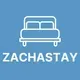 Blue logo with a white outlined sofa icon above the word “ZACHTASTAY”