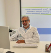 Logo del Centro Medico San Giuseppe: una figura all'interno di un cerchio blu e verde, con testo sottostante.