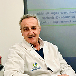 Logo del Centro Medico San Giuseppe: una figura all'interno di un cerchio blu e verde, con testo sottostante.