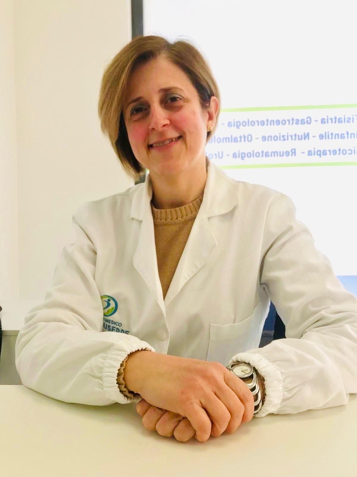 Logo del Centro Medico San Giuseppe: una figura all'interno di un cerchio blu e verde, con testo sottostante.