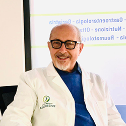 Logo del Centro Medico San Giuseppe: una figura all'interno di un cerchio blu e verde, con testo sottostante.