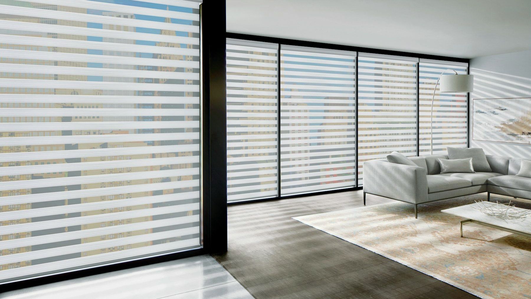 Hunter Douglas Banded Shades with horizontal stripes in a minimalist room