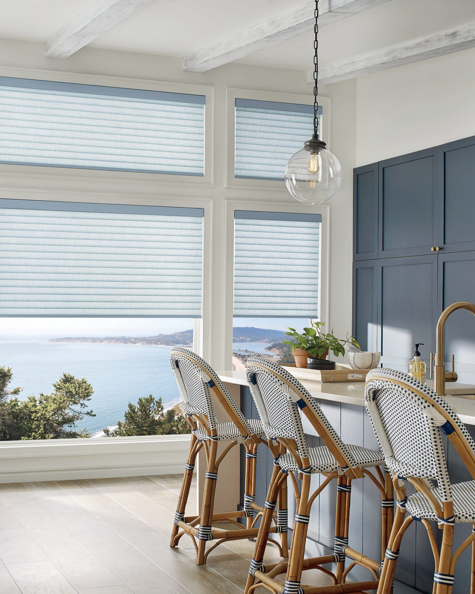 Kitchen with custom roller shades installed in Lambertville, NJ for modern light control.