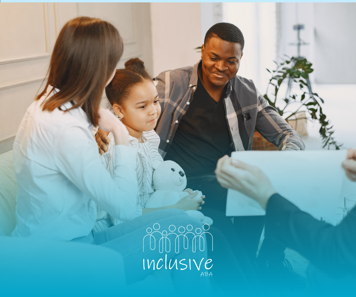 Family talking with a counselor in a bright office.