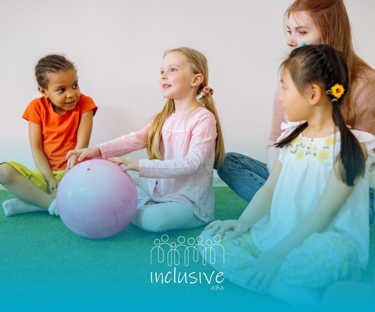 Children sitting in a circle with a pastel ball in a bright playroom, engaging in inclusive group play