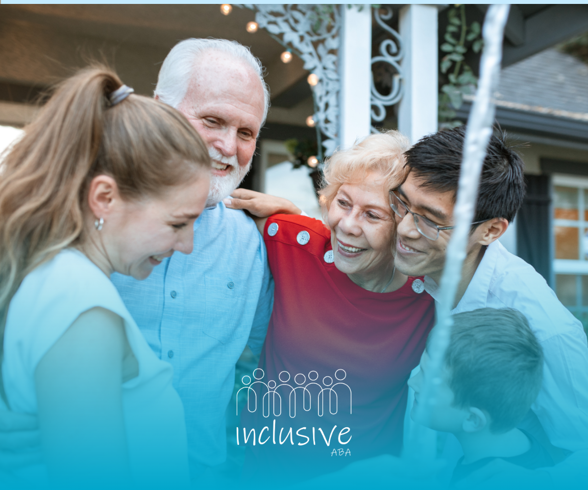 Group of people smiling together outdoors under a porch, gathered around an older woman in red.