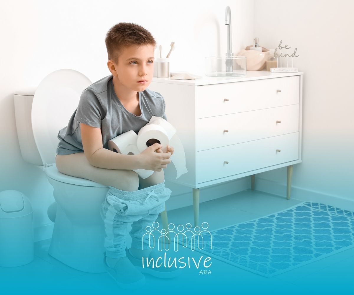 Child sitting on a toilet in a bright bathroom, holding toilet paper near a blue rug.