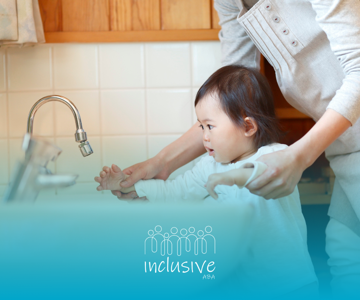 Parent guiding a toddler's hands under the faucet at a home bathroom sink.