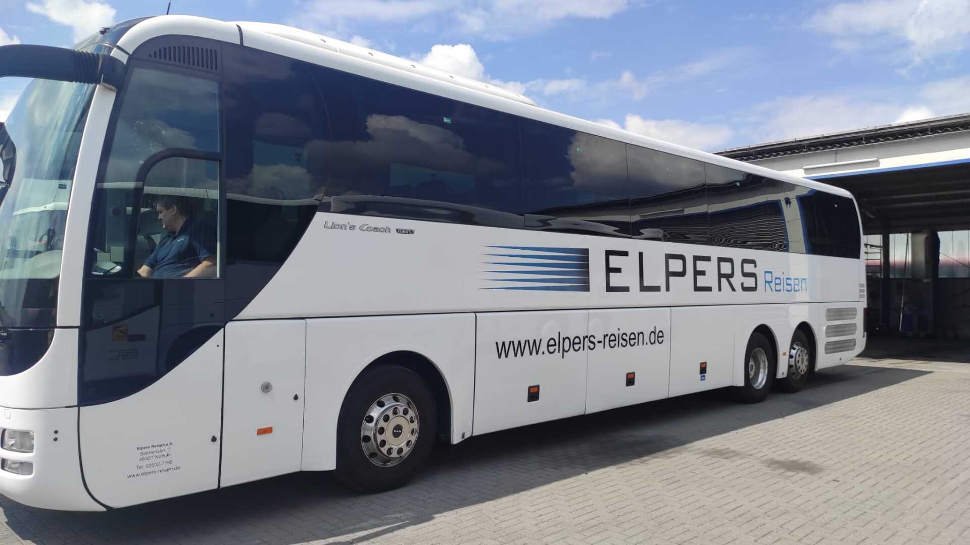 A white bus with the word elpers on it