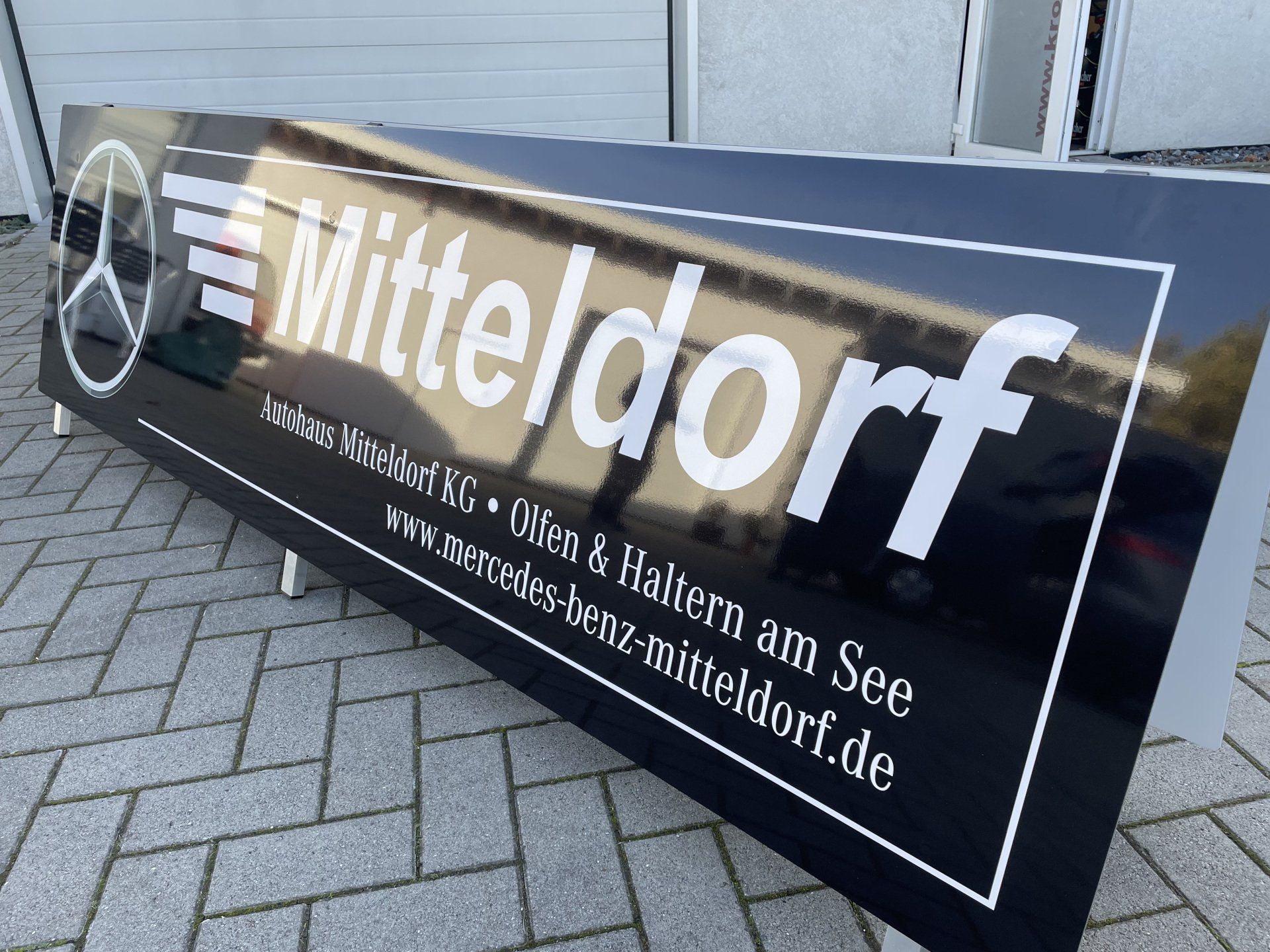 A large black sign that says mitteldorf on it