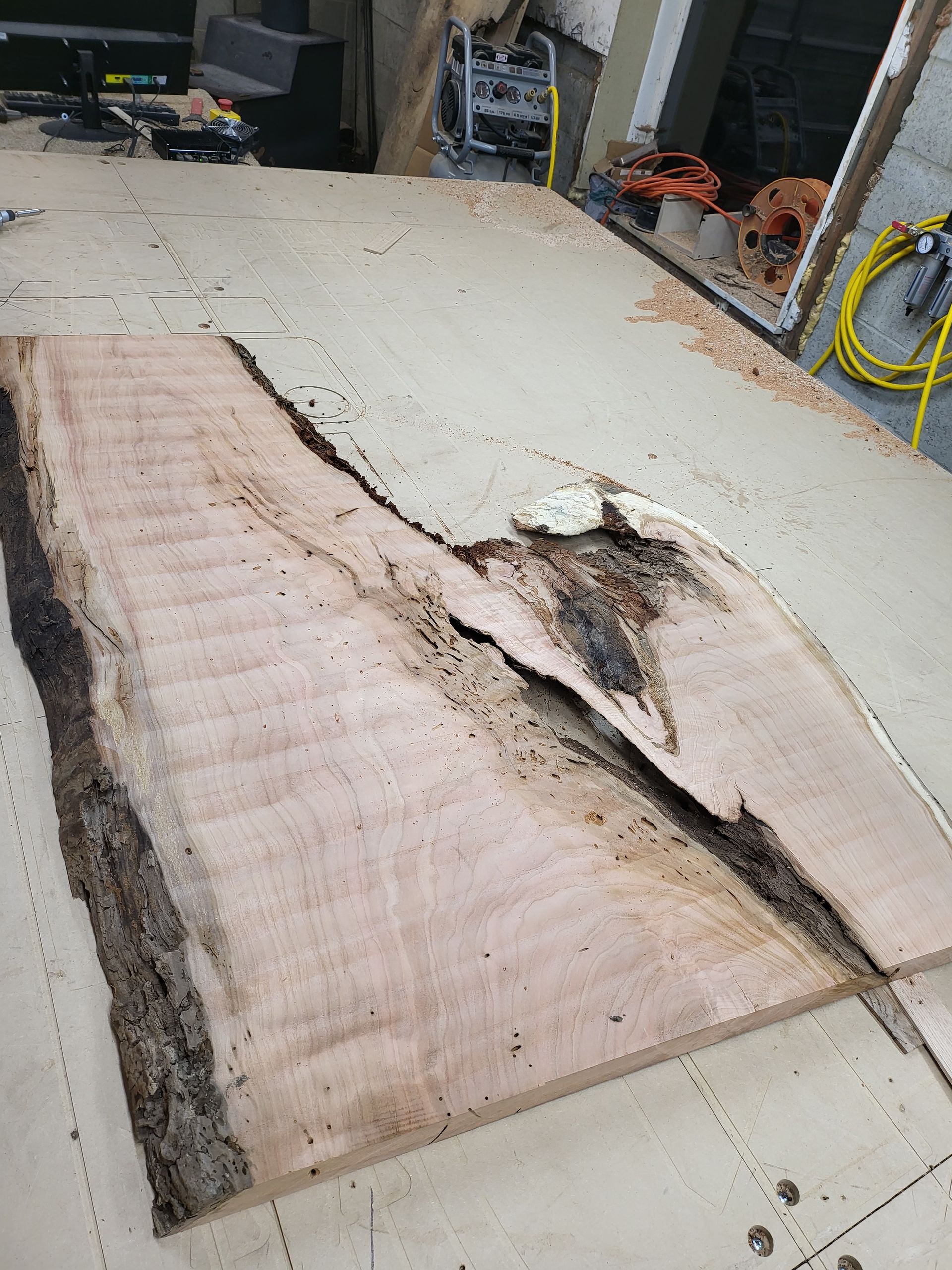 A piece of wood is sitting on top of a table.