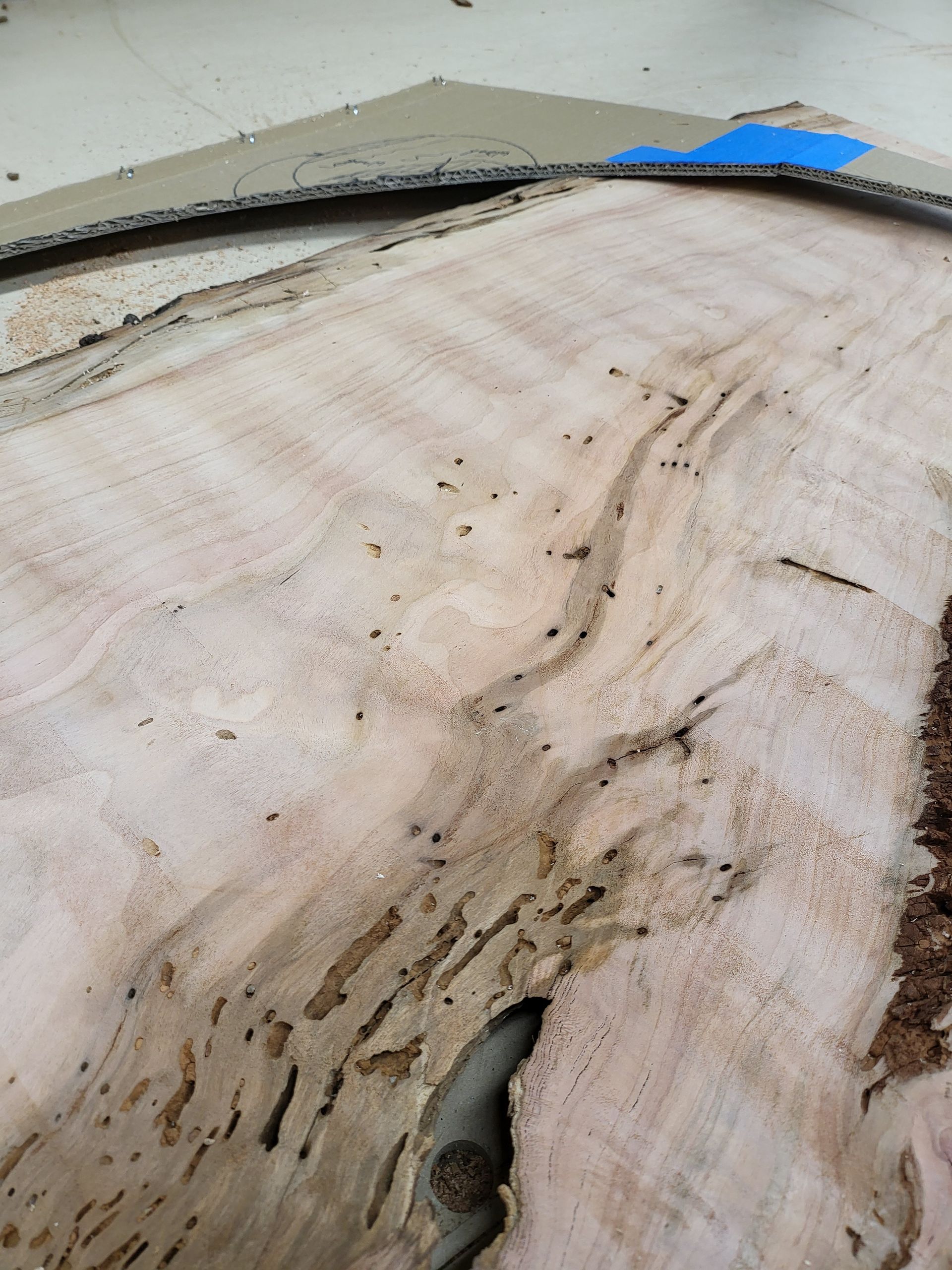 A close up of a piece of wood with a hole in it