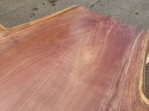 A close up of a piece of wood on a table.