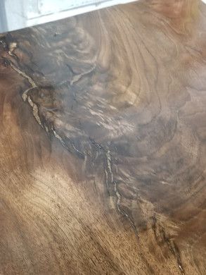 A close up of a piece of wood on a table.