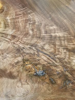 A close up of a piece of wood with a hole in it.