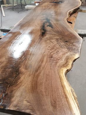 A large piece of wood is sitting on top of a table.
