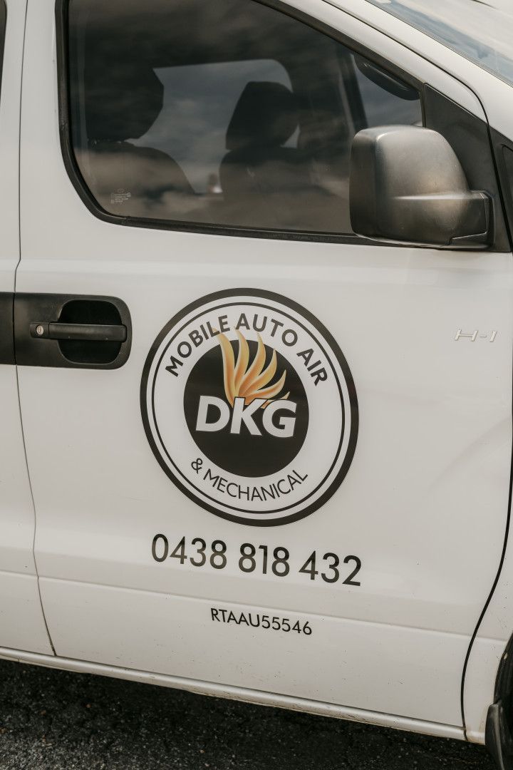 A white van with the word mobile auto air on the side