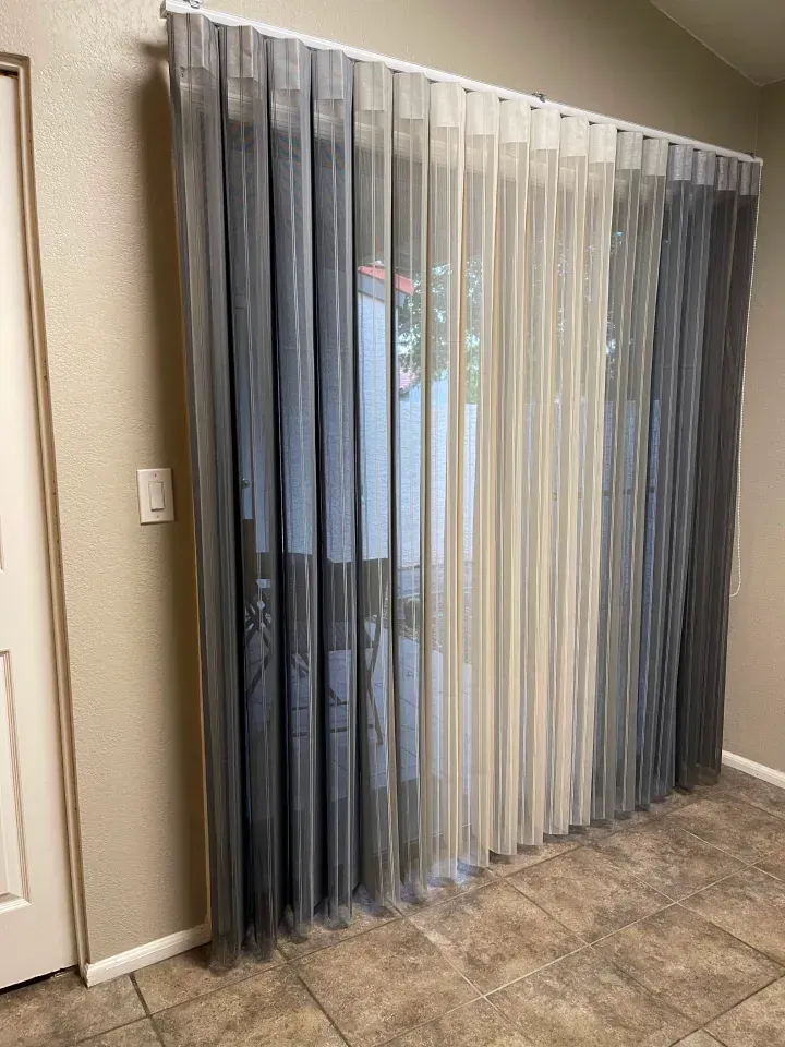 a window that is covered by vertical blinds