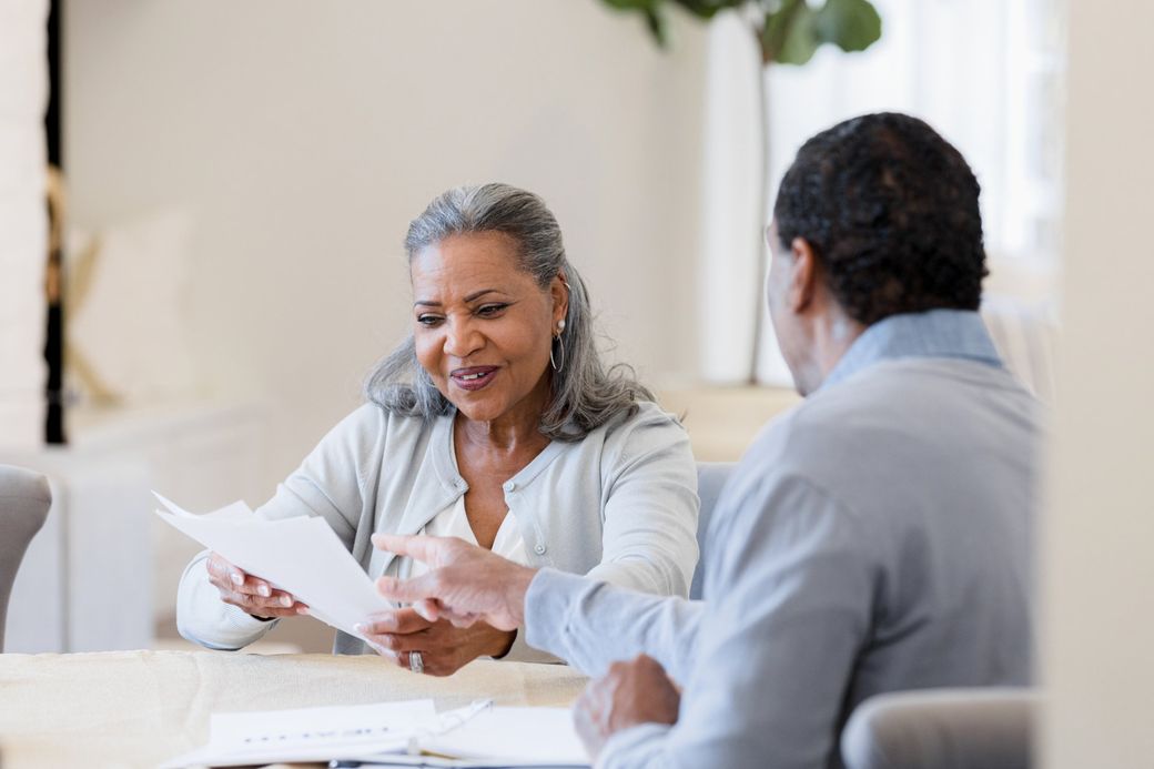 Women Holding Pencil And Notebook | Norfolk, VA | James Accounting & Tax Office