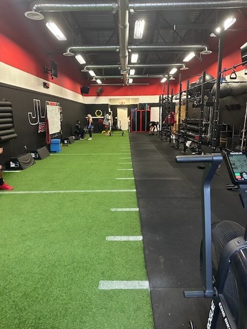 A large room with a coke machine in the middle
