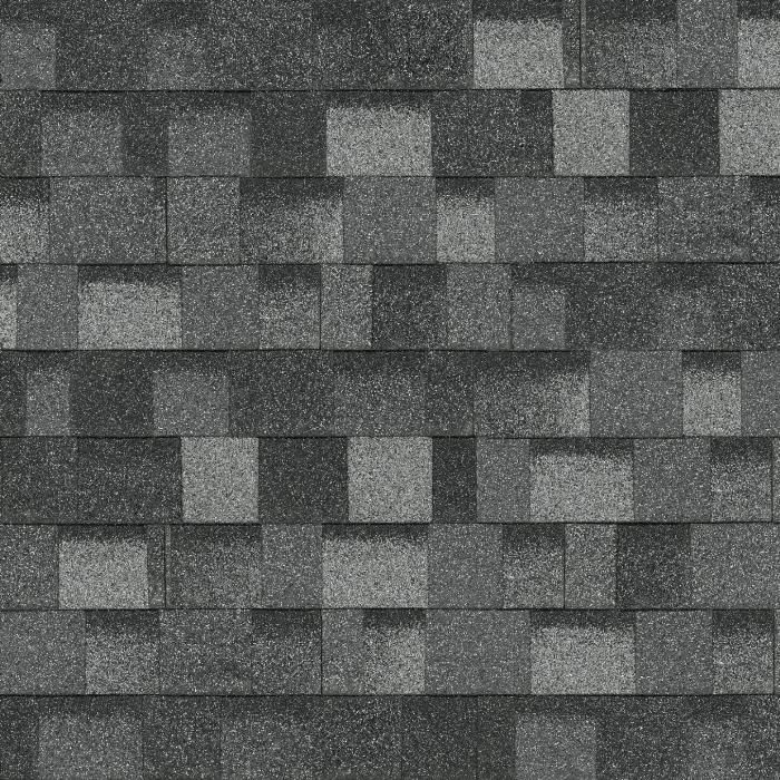Bardeaux de toiture en asphalte gris et anthracite posés en quinconce.